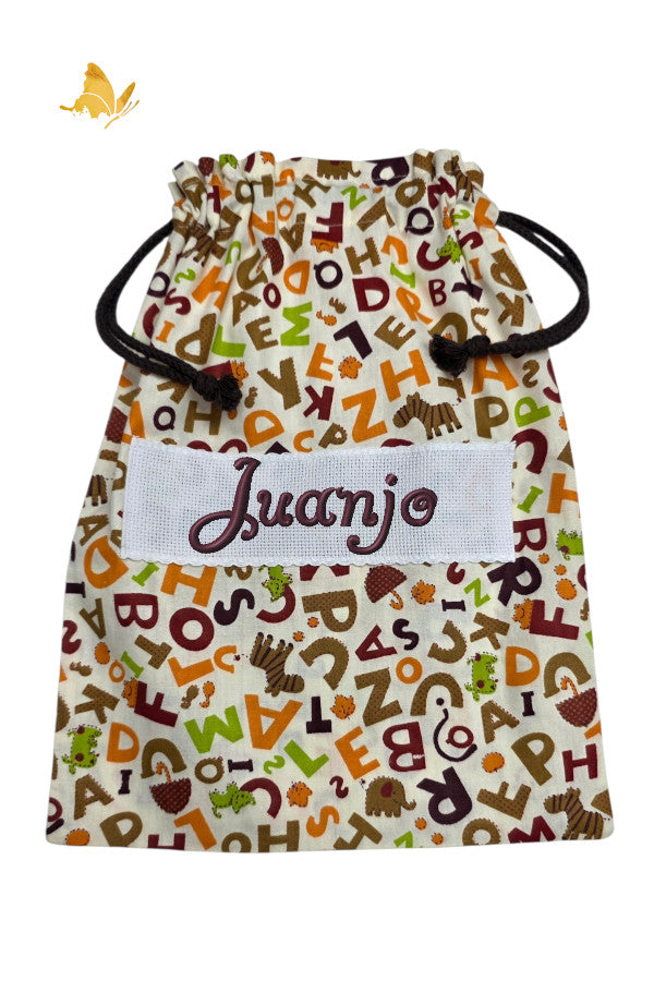 Bolsa merienda artesanal letras de colores con nombre bordado, algodón 100%, guardería