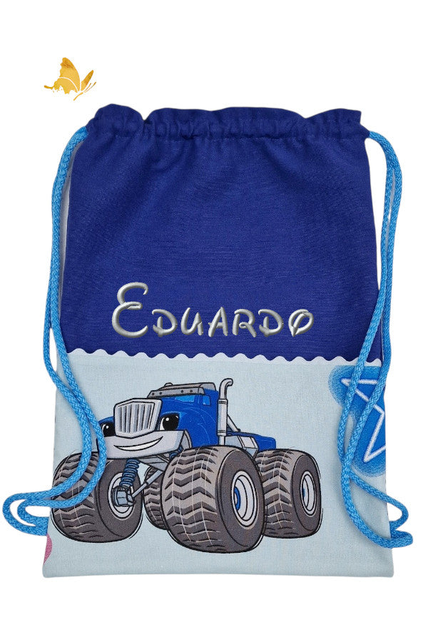 Mochila infantil Crusher azul eléctrico bordada con nombre, bolsillo algodón azul claro y asas azul claro, hecha a mano por Bordados de Tania